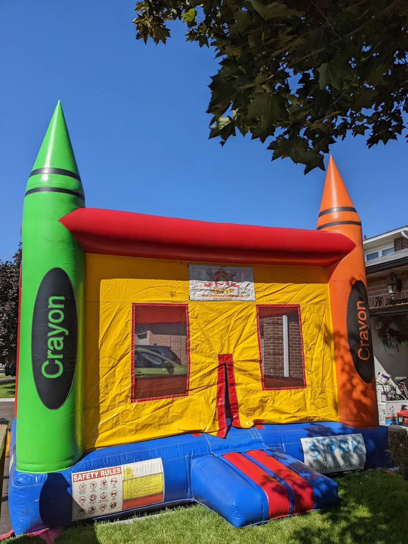 Colorful Crayola Bouncy Castle inflatable rental full exterior — The Bouncy Castle King, serving the GTA