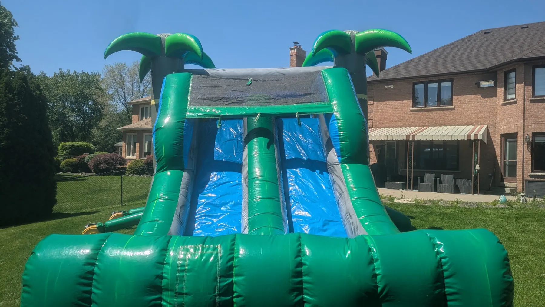 Double Slide Tropical Bouncy Castle inflatable rental gallery view 8 — The Bouncy Castle King, serving the GTA