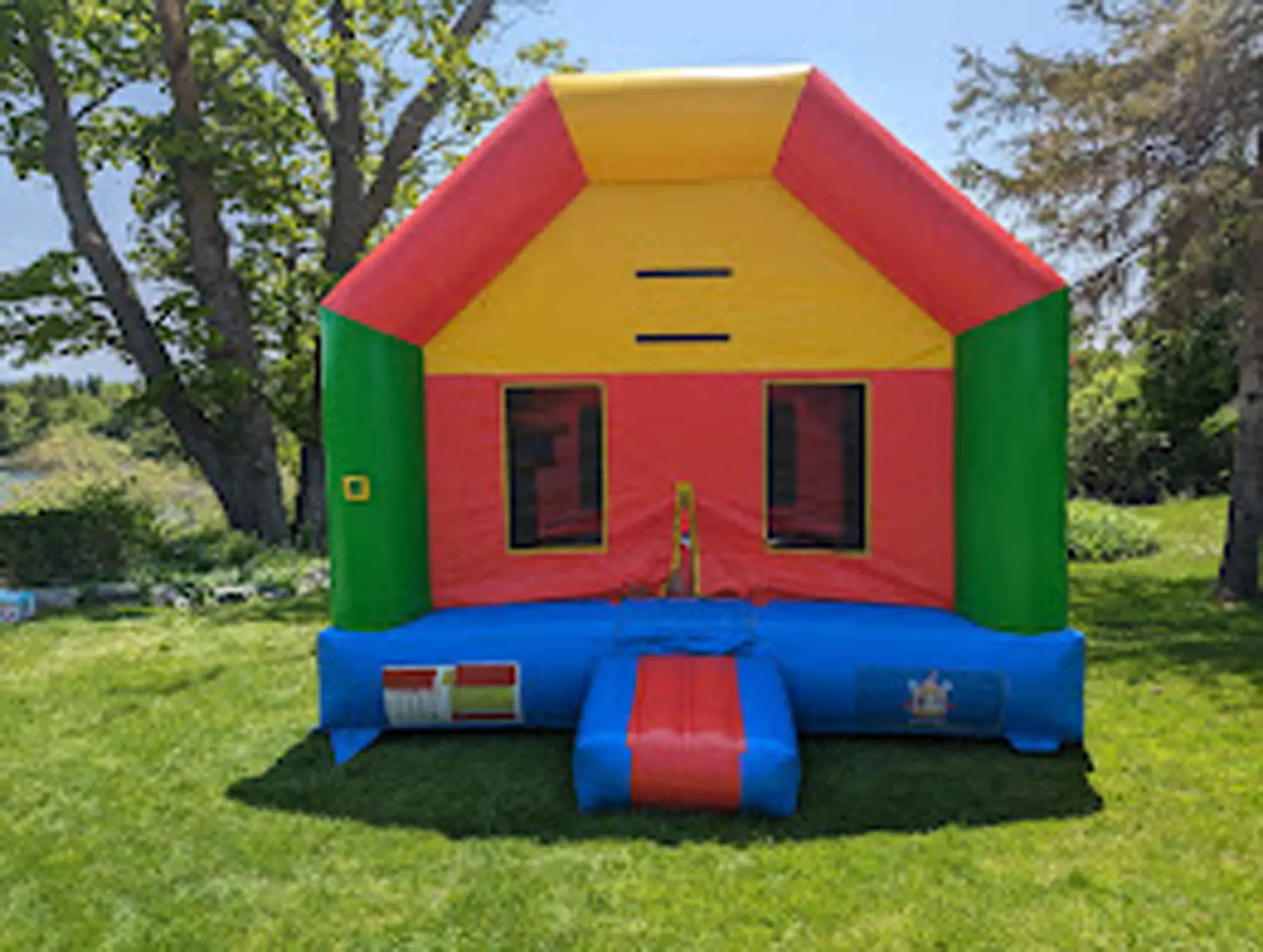 Colorful Bouncy Bouncy Castle (Adults Too) inflatable rental full exterior β The Bouncy Castle King, serving the GTA