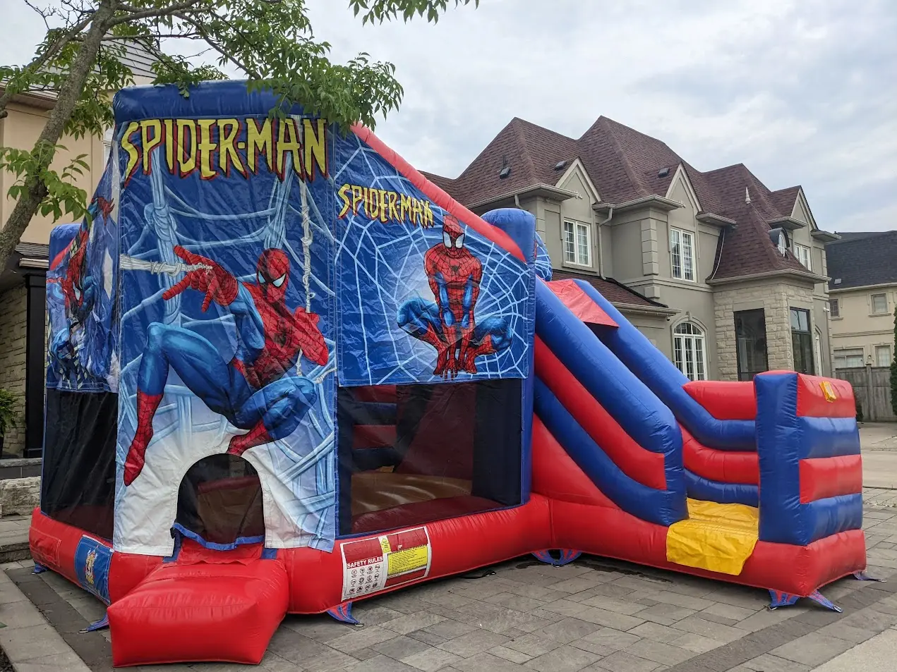Spider Man Combo Bouncy Castle inflatable rental full exterior — The Bouncy Castle King, serving the GTA